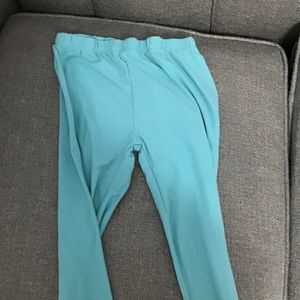 A pair of teal leggings.